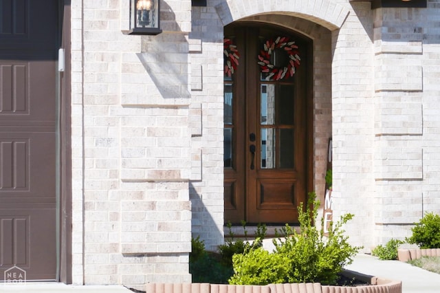 109 Old Eli Rd, Monette, AR 72447 - view of exterior entry featuring brick siding and french doors