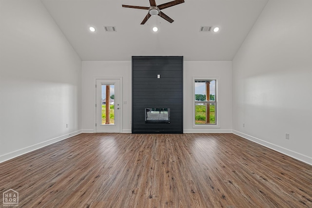 1816 N Oak, Brookland, AR 72417 - unfurnished living room with a large fireplace, ceiling fan, wood finished floors, recessed lighting, and high vaulted ceiling