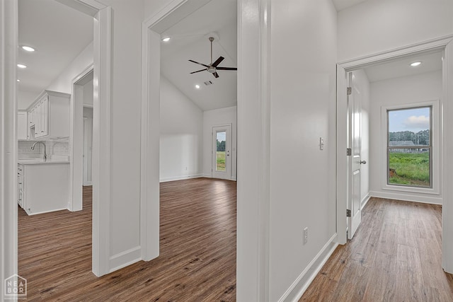 1816 N Oak, Brookland, AR 72417 - hallway featuring wood finished floors, recessed lighting, and lofted ceiling