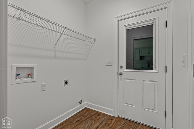 1816 N Oak, Brookland, AR 72417 - washroom with hookup for an electric dryer, hookup for a washing machine, and dark wood-style floors
