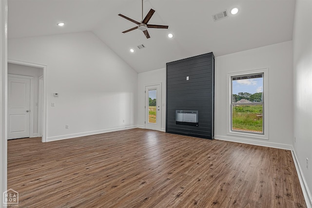 1816 N Oak, Brookland, AR 72417 - unfurnished living room featuring a ceiling fan, wood finished floors, a large fireplace, high vaulted ceiling, and recessed lighting