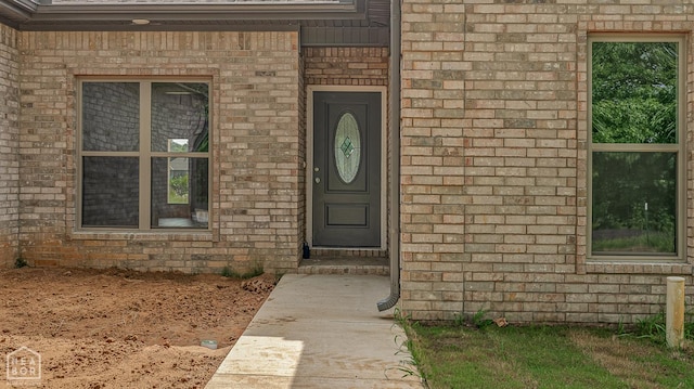 1816 N Oak, Brookland, AR 72417 - doorway to property featuring brick siding