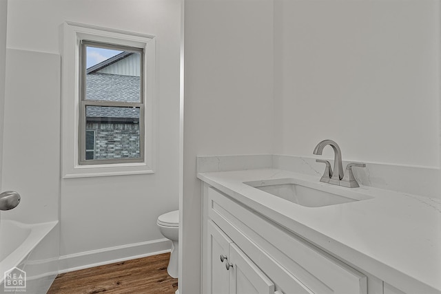 1816 N Oak, Brookland, AR 72417 - bathroom featuring vanity and wood finished floors