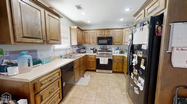403 Brookstone Dr, Jonesboro, AR 72404 - kitchen with light countertops, light tile patterned flooring, black appliances, visible vents, and a sink