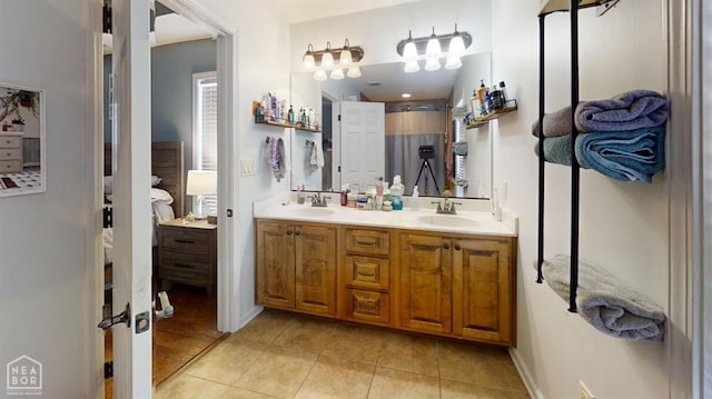 403 Brookstone Dr, Jonesboro, AR 72404 - full bathroom featuring a sink, double vanity, and tile patterned flooring