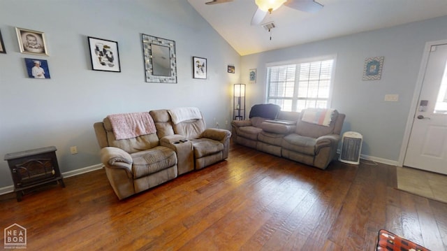 403 Brookstone Dr, Jonesboro, AR 72404 - living room with baseboards, a wood stove, ceiling fan, high vaulted ceiling, and hardwood / wood-style floors