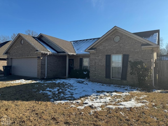 403 Brookstone Dr, Jonesboro, AR 72404 - single story home with a garage, fence, and brick siding