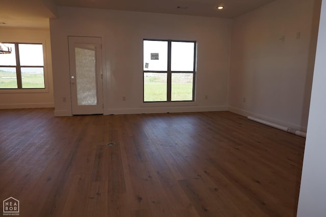 311 Hollis Cv, Bono, AR 72416 - unfurnished room with hardwood / wood-style floors, baseboards, a chandelier, and recessed lighting