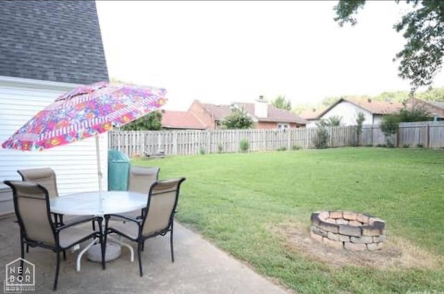2704 Greenbriar Dr, Jonesboro, AR 72401 - fenced backyard featuring an outdoor fire pit, outdoor dining space, and a patio area