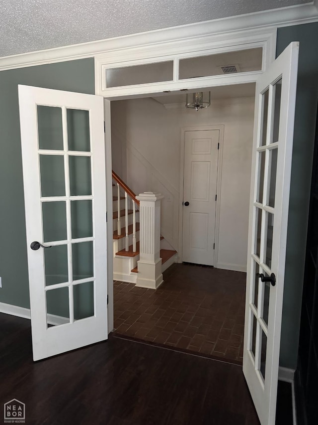 2704 Greenbriar Dr, Jonesboro, AR 72401 - entrance foyer featuring stairs, french doors, crown molding, and brick patterned floors