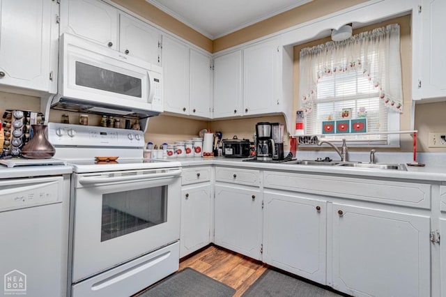 2300 Mount Carmel Rd, Paragould, AR 72450 - kitchen featuring white appliances, a sink, ornamental molding, white cabinets, and light countertops