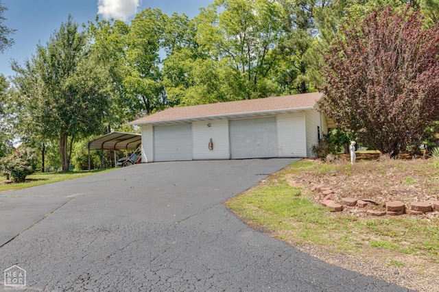 2300 Mount Carmel Rd, Paragould, AR 72450 - garage with a garage and view of scattered trees