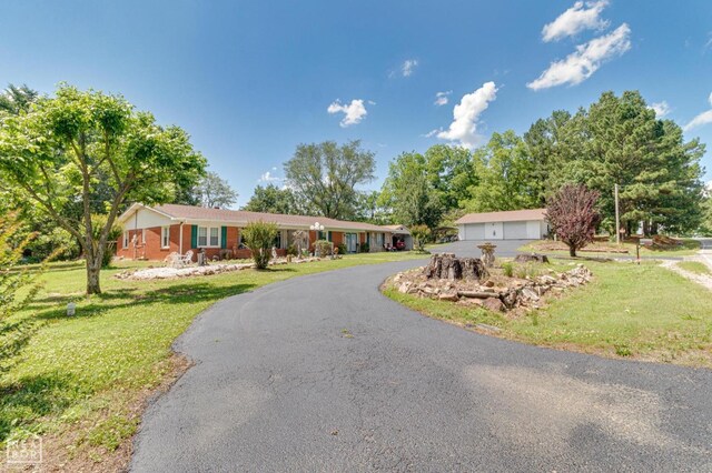 2300 Mount Carmel Rd, Paragould, AR 72450 - single story home featuring a front yard and a garage