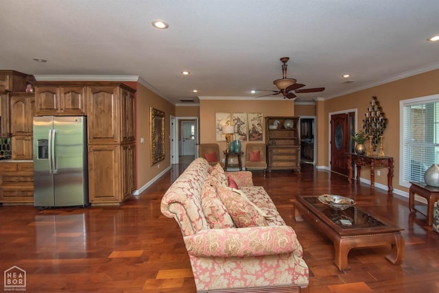 living room with dark wood finished floors, ornamental molding, baseboards, and ceiling fan
