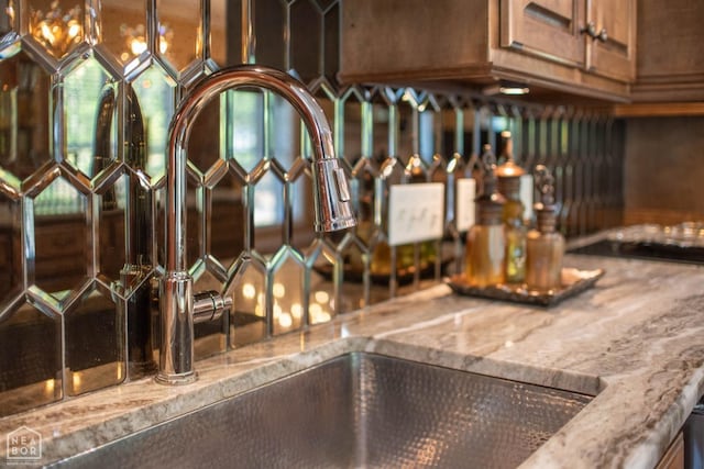 details with a sink and light stone counters