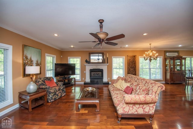 living room featuring baseboards, wood finished floors, recessed lighting, and ornamental molding