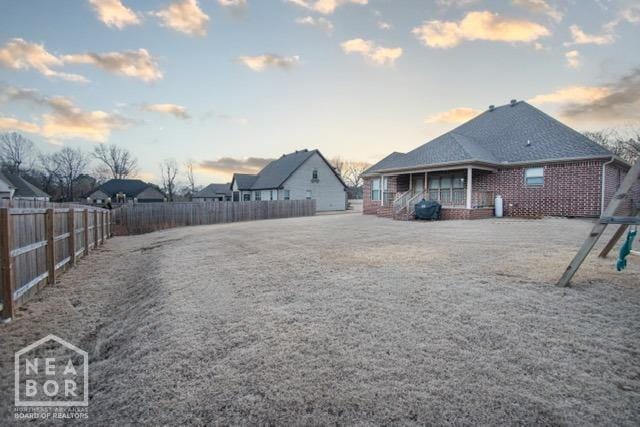 view of yard with a fenced backyard