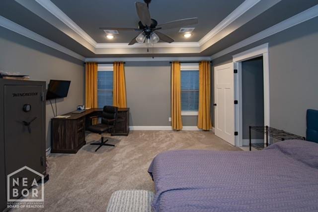 bedroom featuring carpet flooring, ornamental molding, and a raised ceiling