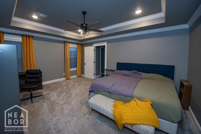bedroom with recessed lighting, carpet, a tray ceiling, and baseboards