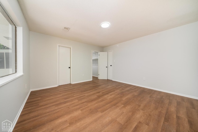 2109 Munos Ln, Jonesboro, AR 72401 - unfurnished bedroom featuring wood finished floors and baseboards
