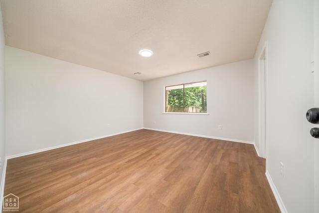 2109 Munos Ln, Jonesboro, AR 72401 - spare room featuring wood finished floors and baseboards