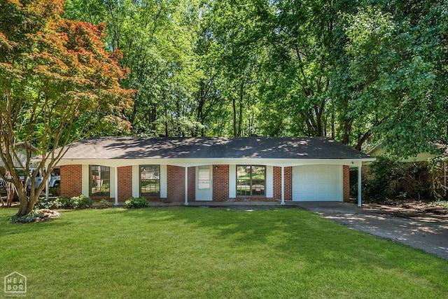 2109 Munos Ln, Jonesboro, AR 72401 - single story home with driveway, a garage, a front lawn, and brick siding
