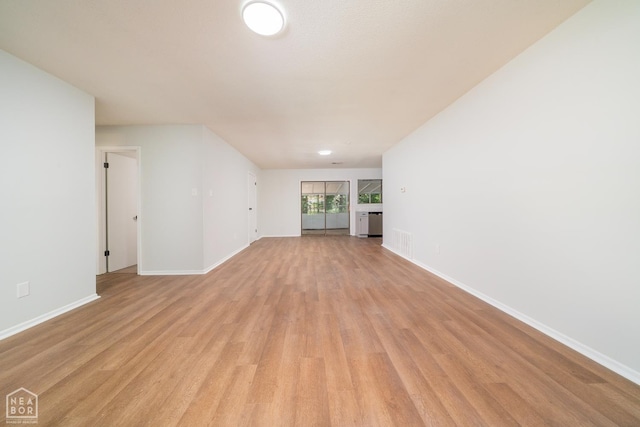 2109 Munos Ln, Jonesboro, AR 72401 - unfurnished living room featuring light wood-style floors and baseboards