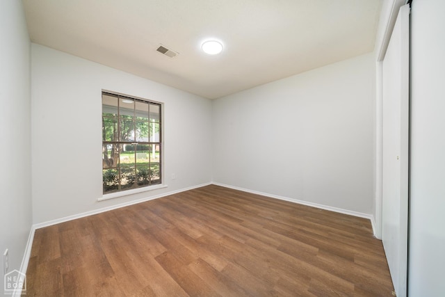 2109 Munos Ln, Jonesboro, AR 72401 - spare room featuring wood finished floors and baseboards