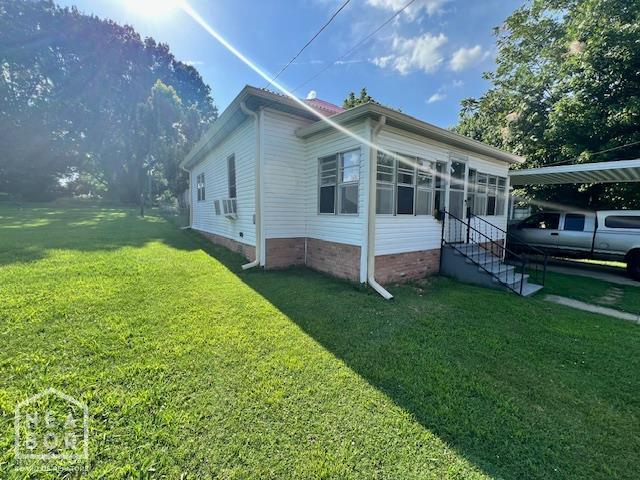 518 N 4th St, Paragould, AR 72450 - view of home's exterior with a yard and cooling unit