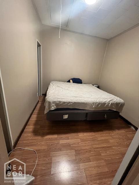 518 N 4th St, Paragould, AR 72450 - bedroom with attic access and wood finished floors