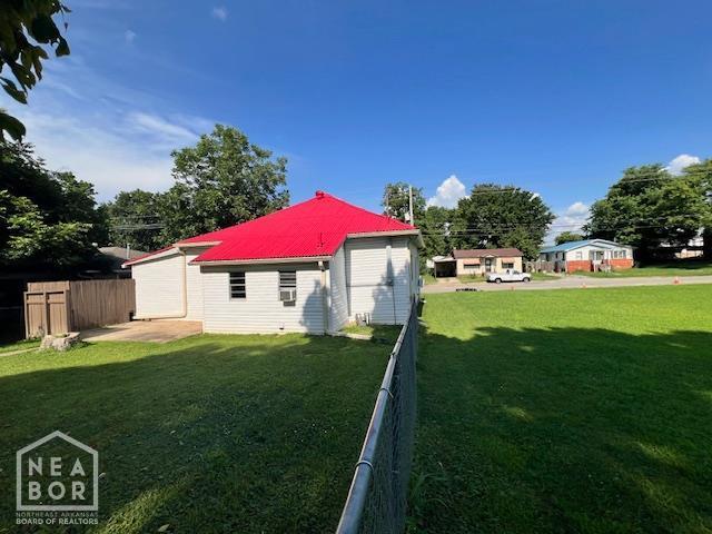 518 N 4th St, Paragould, AR 72450 - rear view of property featuring a metal roof