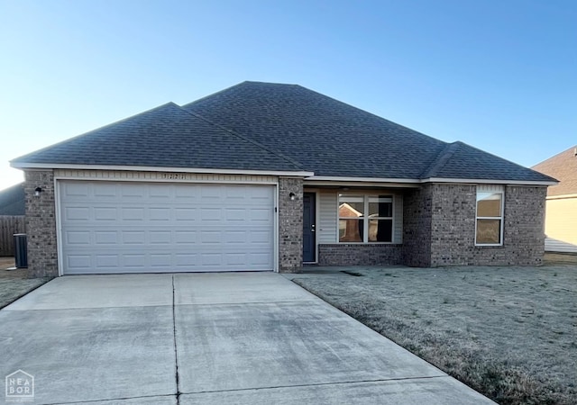 3721 Remington Dr, Jonesboro, AR 72404 - single story home with driveway, brick siding, a garage, and roof with shingles