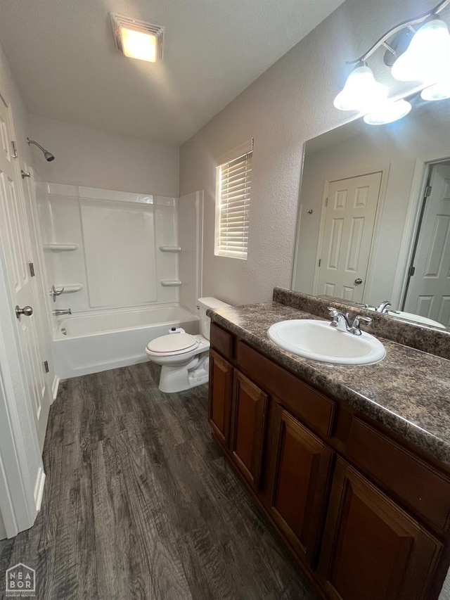 3721 Remington Dr, Jonesboro, AR 72404 - full bath featuring vanity, wood finished floors, toilet, and tub / shower combination
