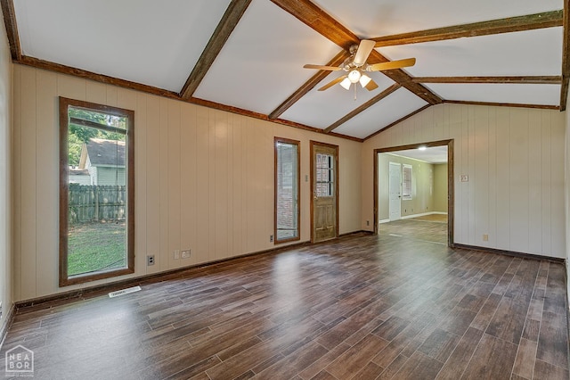 34 Adams St, Wilson, AR 72395 - empty room with wood finished floors, ceiling fan, baseboards, and wood walls