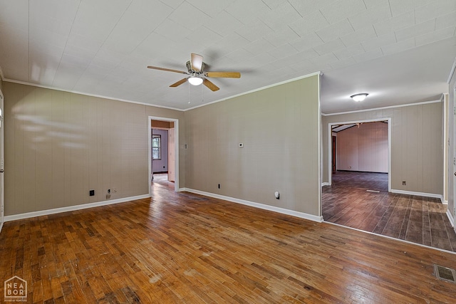 34 Adams St, Wilson, AR 72395 - unfurnished room featuring ornamental molding, a ceiling fan, hardwood / wood-style floors, and baseboards