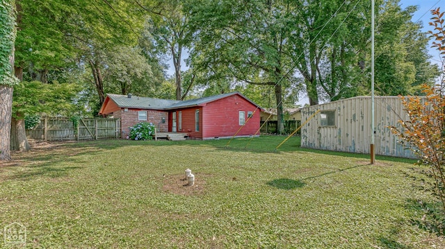34 Adams St, Wilson, AR 72395 - view of yard with an outbuilding