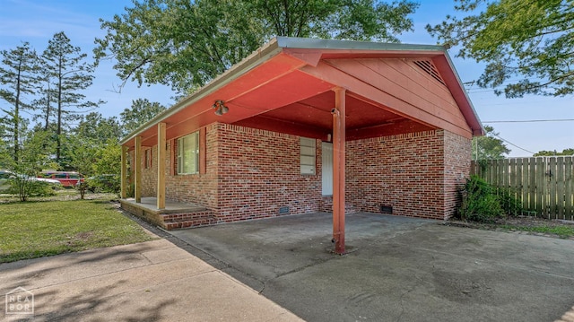 34 Adams St, Wilson, AR 72395 - view of car parking featuring driveway and a carport