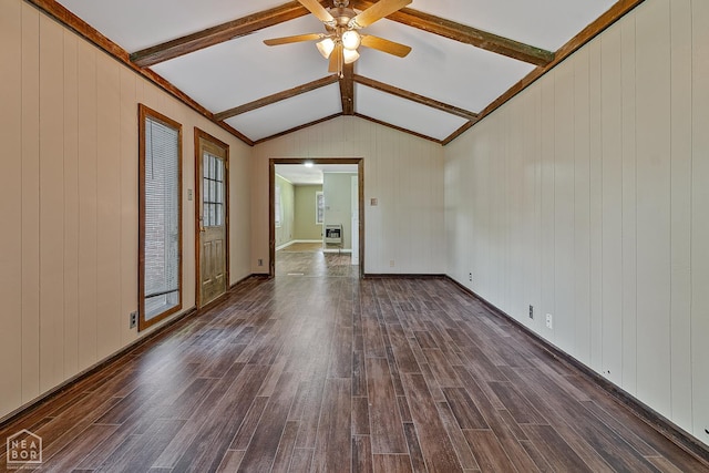34 Adams St, Wilson, AR 72395 - empty room with dark wood finished floors, a ceiling fan, heating unit, and wood walls