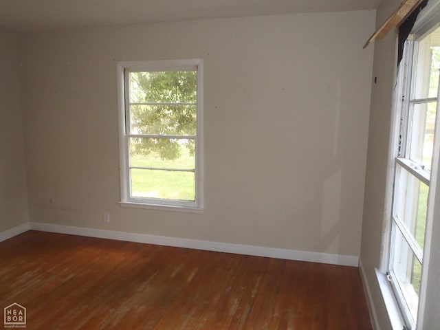 545 E Raney Ave, Mccrory, AR 72101 - empty room featuring hardwood / wood-style floors and plenty of natural light