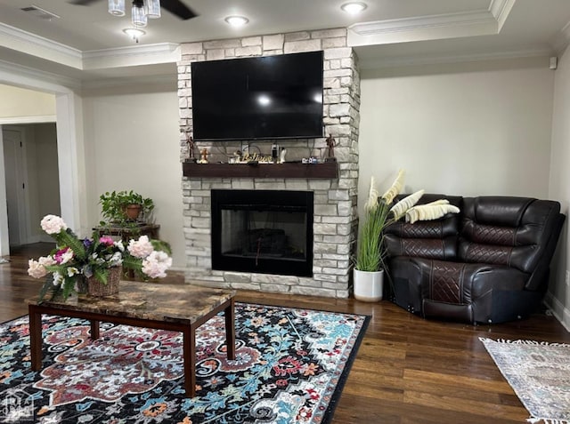 828 Laura Lea, Jonesboro, AR 72401 - living room with wood finished floors, crown molding, a stone fireplace, a tray ceiling, and ceiling fan