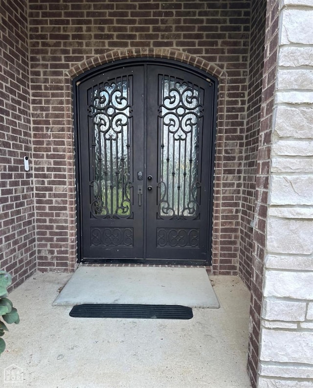828 Laura Lea, Jonesboro, AR 72401 - doorway to property with brick siding and french doors