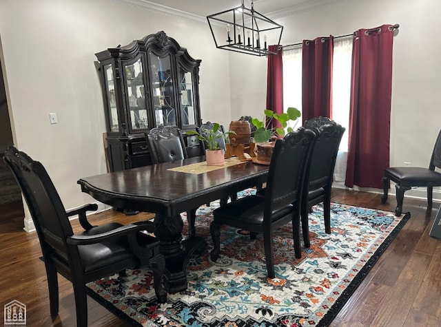 828 Laura Lea, Jonesboro, AR 72401 - dining space featuring ornamental molding, a chandelier, and dark wood-type flooring