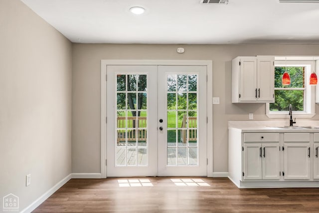 1615 Duncan Rd, Jonesboro, AR 72401 - entryway featuring french doors, wood finished floors, and recessed lighting