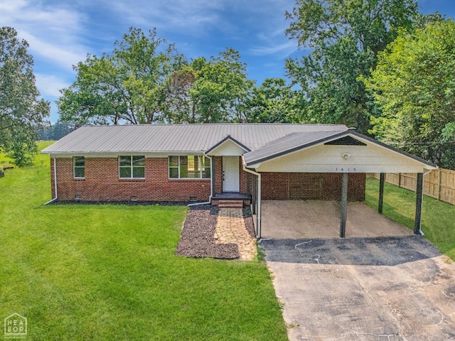 1615 Duncan Rd, Jonesboro, AR 72401 - single story home featuring asphalt driveway, a carport, and brick siding