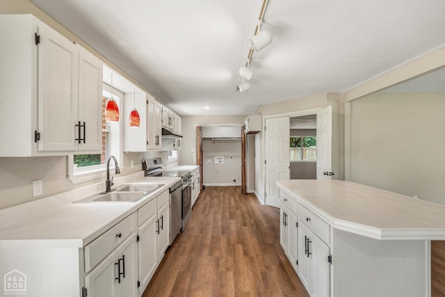 1615 Duncan Rd, Jonesboro, AR 72401 - kitchen featuring stainless steel range with electric stovetop, dark wood-type flooring, white cabinets, a center island, and rail lighting