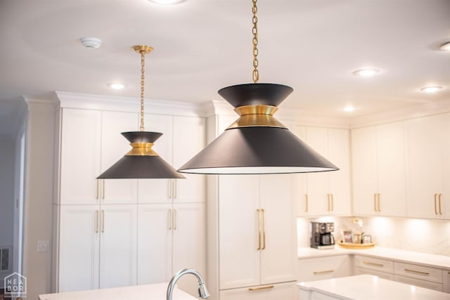 1203 Dove Rd, Jonesboro, AR 72401 - details with white cabinetry, recessed lighting, decorative light fixtures, and light countertops