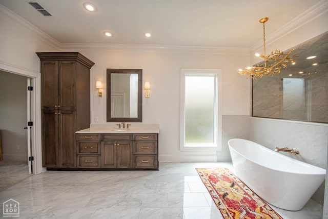 1203 Dove Rd, Jonesboro, AR 72401 - full bath featuring visible vents, a freestanding tub, vanity, a notable chandelier, and marble finish floor