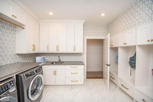 1203 Dove Rd, Jonesboro, AR 72401 - laundry room featuring recessed lighting, washer and dryer, cabinet space, marble finish floor, and a sink