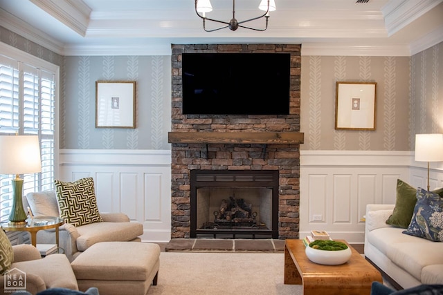 1203 Dove Rd, Jonesboro, AR 72401 - living area with wainscoting, a raised ceiling, an inviting chandelier, and crown molding