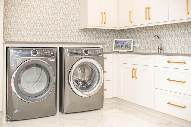 1203 Dove Rd, Jonesboro, AR 72401 - clothes washing area featuring separate washer and dryer, wallpapered walls, cabinet space, marble finish floor, and a sink